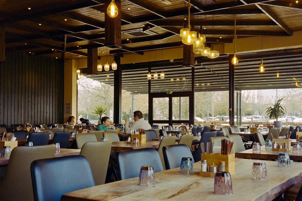 A warm and inviting French bistro with modern decor and casual diners.